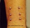 arm surface piercing