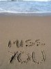 Miss you message written in sand