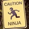 a 'CAUTION:  NINJA' sign