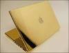 gold plated mac laptop