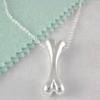 womans silver dogbone necklace